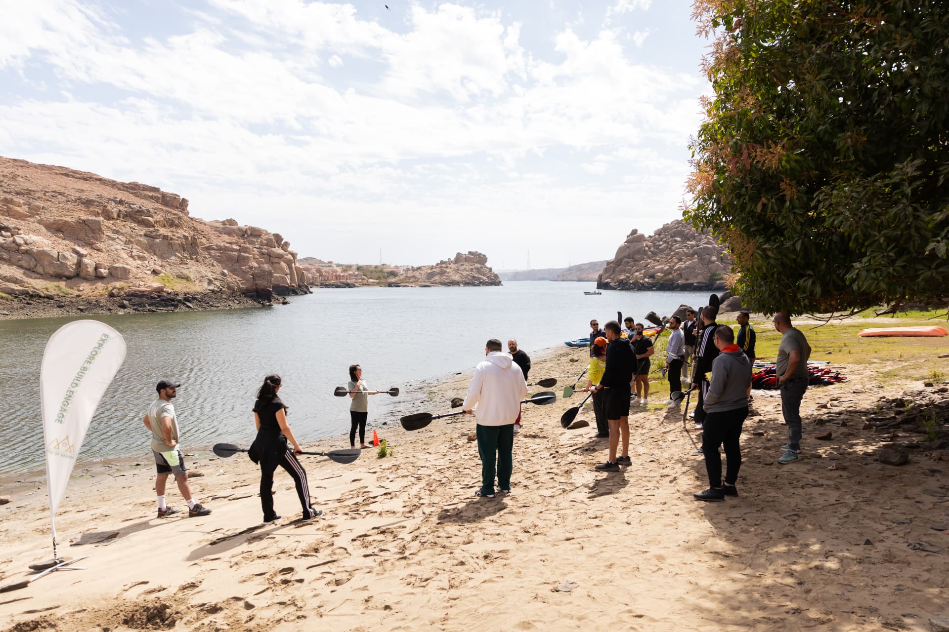 A facilitator briefing a team before kayaking on the Nile