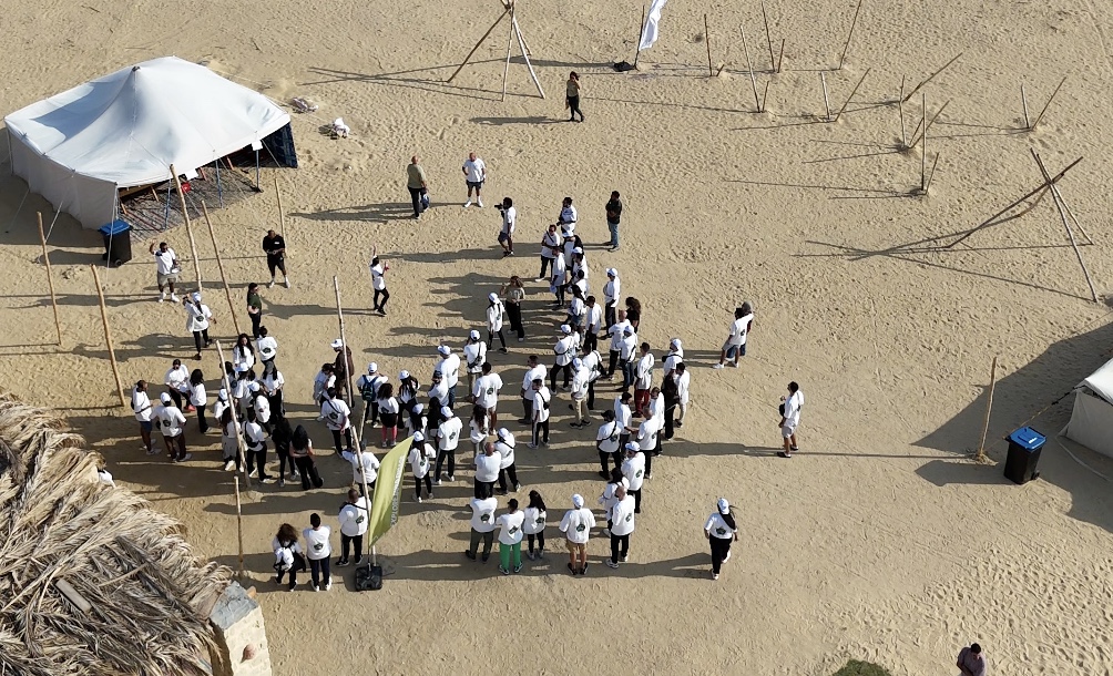 An aerial view of a corporate gathering in the desert